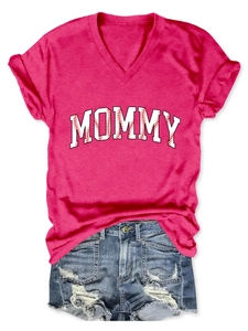 Detail of rose red V-neck T-shirt with mommy text featuring baseball stitch pattern