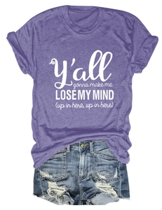 Flat lay of purple short sleeve t-shirt with letter print and blue distressed denim shorts