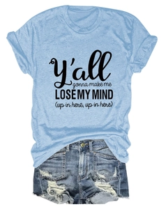 Flat lay of light blue slogan t-shirt with distressed denim shorts summer casual outfit set