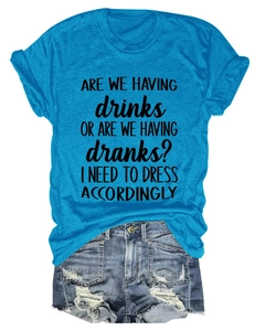 Flat lay of blue cotton graphic t-shirt paired with distressed denim summer shorts
