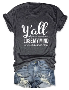 Detail of grey crewneck T-shirt with white text print paired with distressed denim shorts