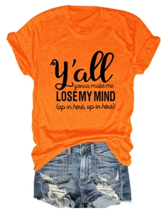 Detailed flat lay of an orange cotton T-shirt with black text and distressed denim shorts