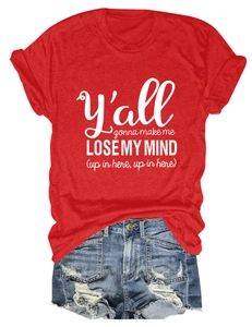 Flat lay of red crew neck T-shirt with white text and distressed blue denim shorts