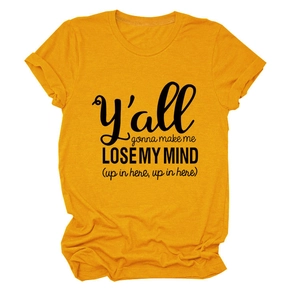 Detail of soft mustard yellow crew neck T-shirt featuring black slogan print texture