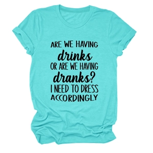 Detail of mint green cotton t-shirt featuring black ARE WE HAVING DRINKS slogan print