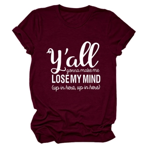 Close-up of maroon cotton t-shirt fabric texture and white printed typography on chest