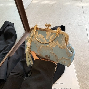 Light blue floral jacquard qipao bag with gold metal handle and green tassel