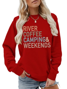 Detail of the colorful art text print and ribbed cuffs on the red crewneck sweatshirt