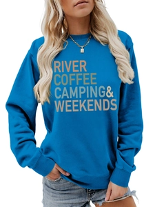 Close-up of the River Coffee Camping graphic print on a blue crewneck sweatshirt
