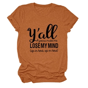 Detail of rust red crew neck t-shirt featuring artistic black slogan typography print
