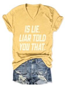 Flat lay of yellow V-neck T-shirt with slogan and ripped denim shorts outfit set