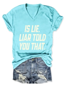 Detail of light blue V-neck T-shirt with IS LIE text print and denim shorts outfit