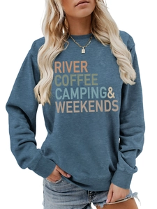 Detail of navy sweatshirt featuring multicolor River Coffee Camping text and soft texture