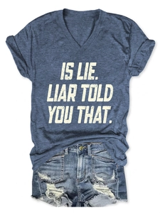 Detail of V-neck navy t-shirt with white text print and frayed denim shorts set