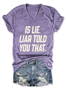 Flat lay of purple V-neck T-shirt with white text print and distressed denim shorts