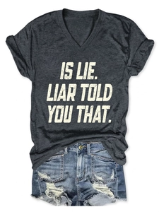 Close-up of V-neck grey marl T-shirt with vintage text and distressed denim shorts