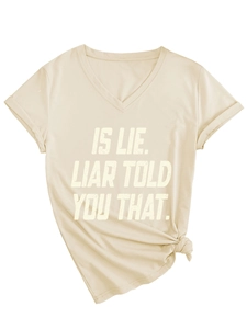 Detail of V-neck T-shirt in apricot with bold letter print and side knot hem design