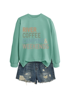 Close-up of River Coffee Camping print on a mint green sweatshirt with ribbed collar