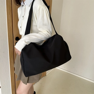 Large capacity black nylon shoulder bag for women traveling with lightweight pillow design