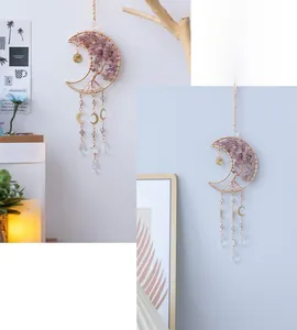 Detailed view of handmade pink crystal Tree of Life within a golden crescent moon frame