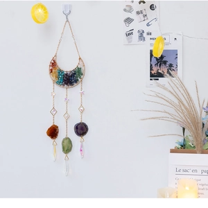 Detail of moon suncatcher with colorful healing stones and natural agate slices