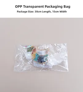 Detail of colorful crystal suncatcher with golden moon frame in OPP packaging