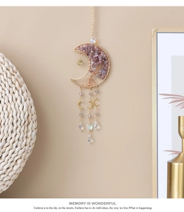 Detail of moon-shaped suncatcher with Tree of Life wire wrap and purple amethyst stones