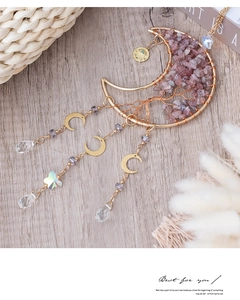 Detail of moon-shaped Tree of Life pendant with purple crystals and golden butterfly charms