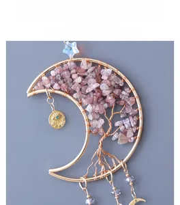 Detail of moon-shaped Tree of Life crystal pendant with rose quartz and gold wire