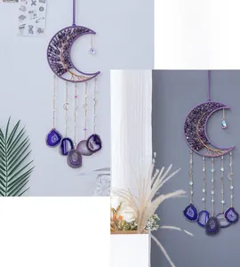 Detail of amethyst crescent moon dreamcatcher with tree of life and agate slice