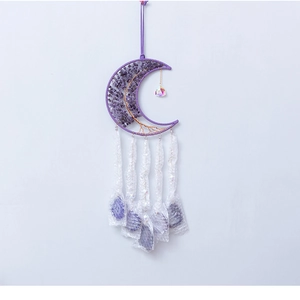 Detail of amethyst moon wall hanging featuring tree of life wire wrap and raw stones
