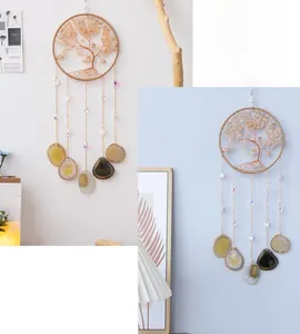 Detailed wall decor showing a gold wire tree of life with citrine and agate slices