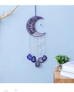Detail of amethyst moon wall hanging featuring wire wrapped tree of life and agate slices