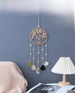 Detail of tree of life dreamcatcher with citrine stones and natural agate slices