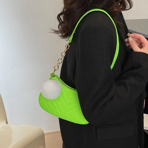 Neon green tweed shoulder bag with V-quilting and decorative white fur pompom charm