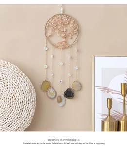 Detail of life tree wall hanging with citrine stones and natural agate slices