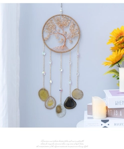 Detail of Tree of Life dream catcher featuring citrine stones and natural agate slices