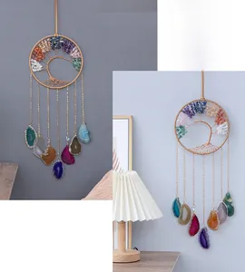 Detail of tree of life wall hanging with natural crystals and polished agate slices