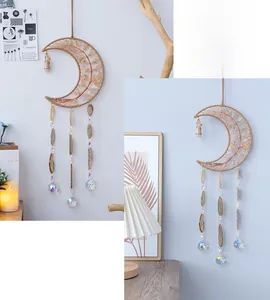 Detail of moon-shaped tree of life hanging with citrine stones and agate slices