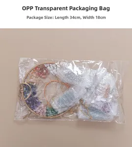 Detailed view of Tree of Life crystal ornament in bubble wrap packaging, size 34x18cm