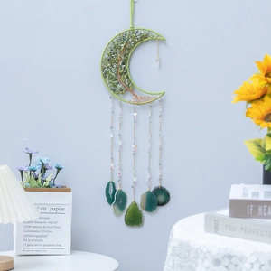 Moon-shaped Tree of Life dream catcher with green crystals and hanging agate slices