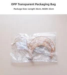 Detail view of moon-shaped citrine crystal wall hanging in transparent OPP packaging