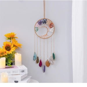 Detail of life tree wall hanging with natural crystal stones and colorful agate slices