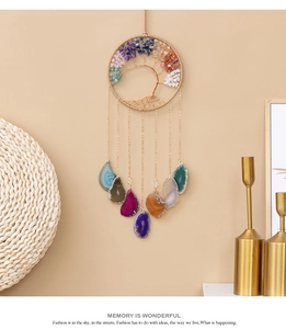 Detail of life tree wall hanging with colorful natural crystal stones and agate slices