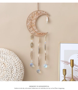 Detail of moon-shaped Citrine tree of life wall hanging with raw stone crystal pendants
