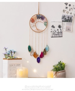 Detail of life tree wall hanging with multi-color natural crystals and agate slices