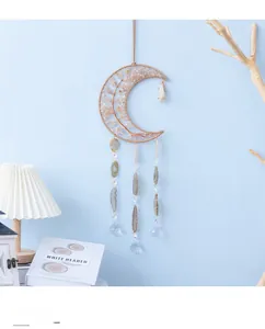 Detail of moon-shaped citrine tree wall hanging with natural agate slices and crystal ball