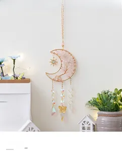 Detail of moon-shaped tree of life wall hanging with pink quartz and crystal beads