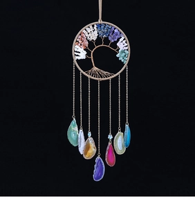 Detail of handmade Tree of Life wall hanging with crystal stones and agate slices