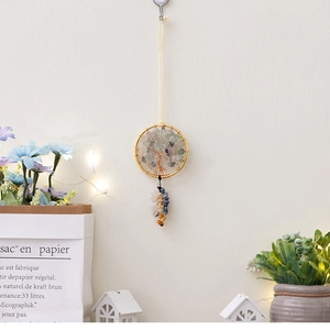 Detail of handmade Tree of Life wall hanging with colorful natural crystal stones